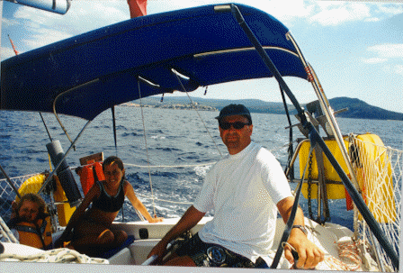 Dave at the helm, with Primosten (night 7) in the background.