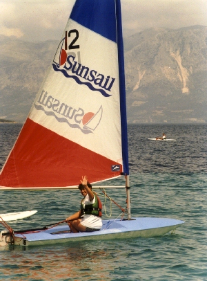 Annemarie sails a Topper - One-handed and backwards.